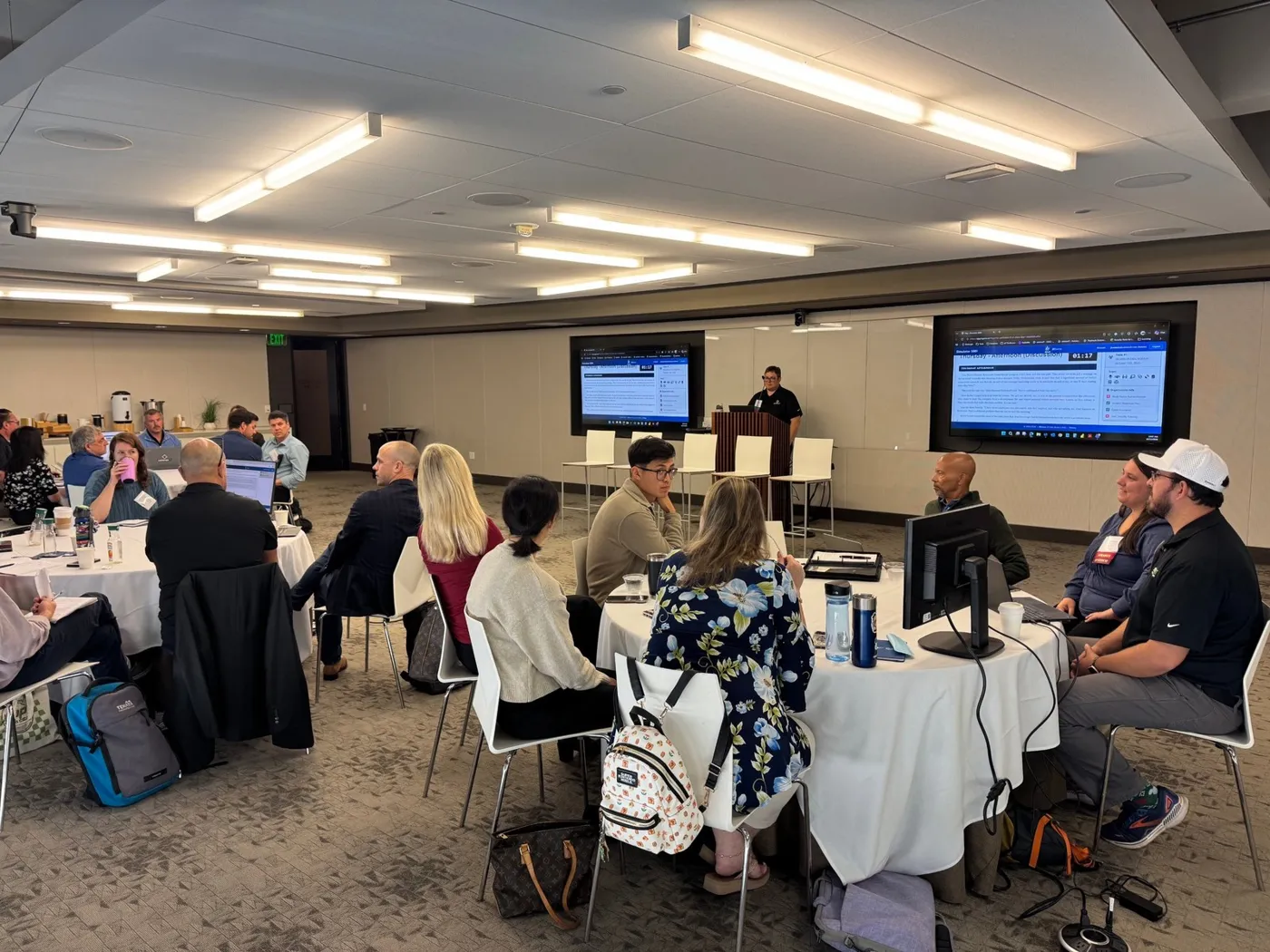 Life sciences leaders work through the cyber crisis scenario at round tables during the October 13 workshop