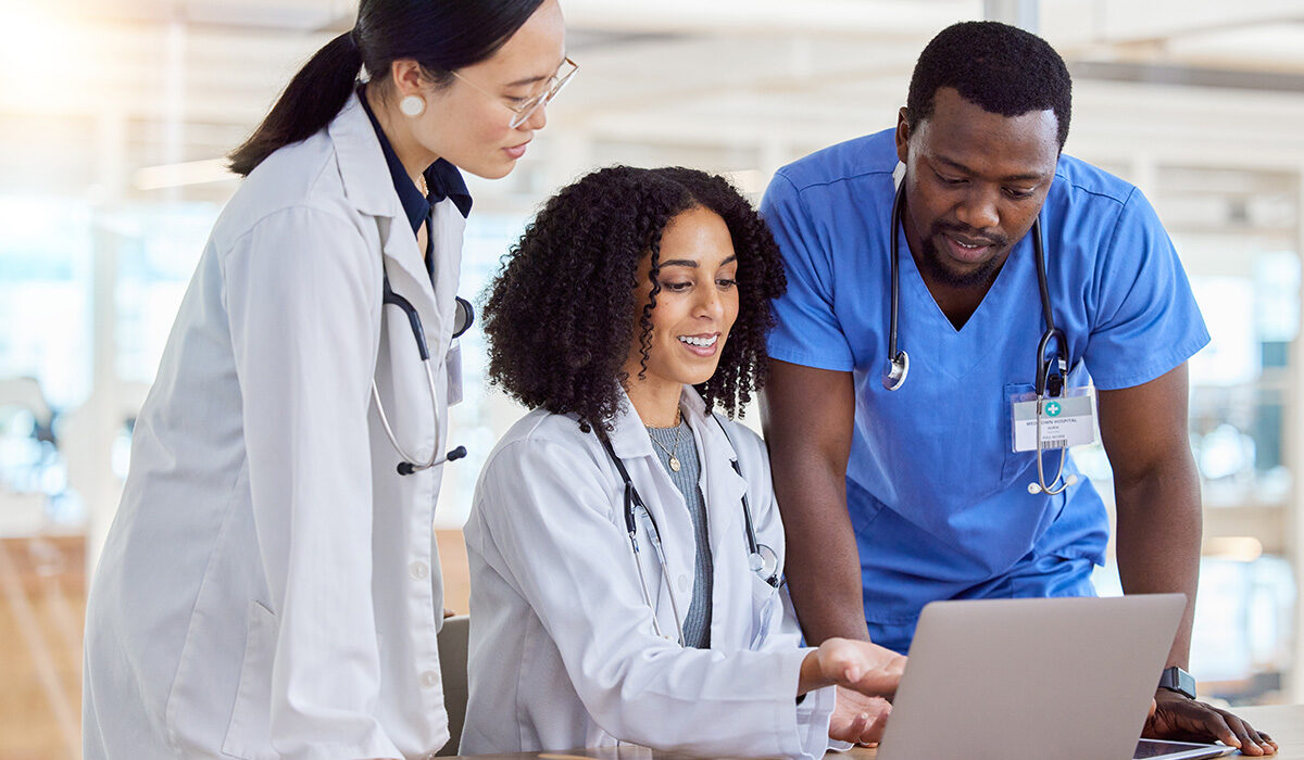 Tablet, collaboration and doctors talking planning in a modern hospital