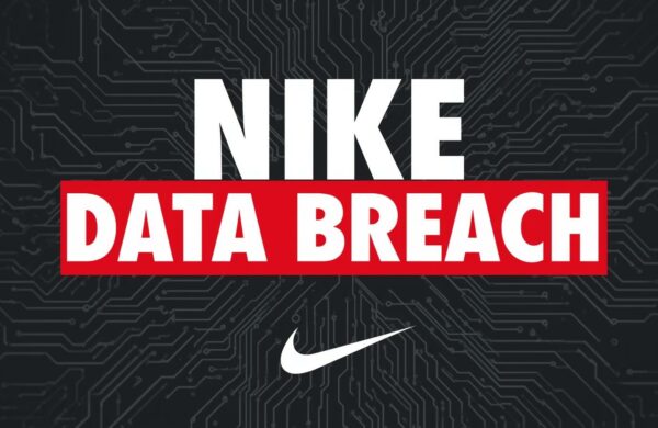 security professional reviewing network access logs on multiple monitors in a standard office environment