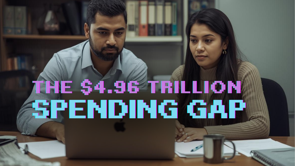 Business owner at a desk reviewing technology options on a laptop in a small office environment